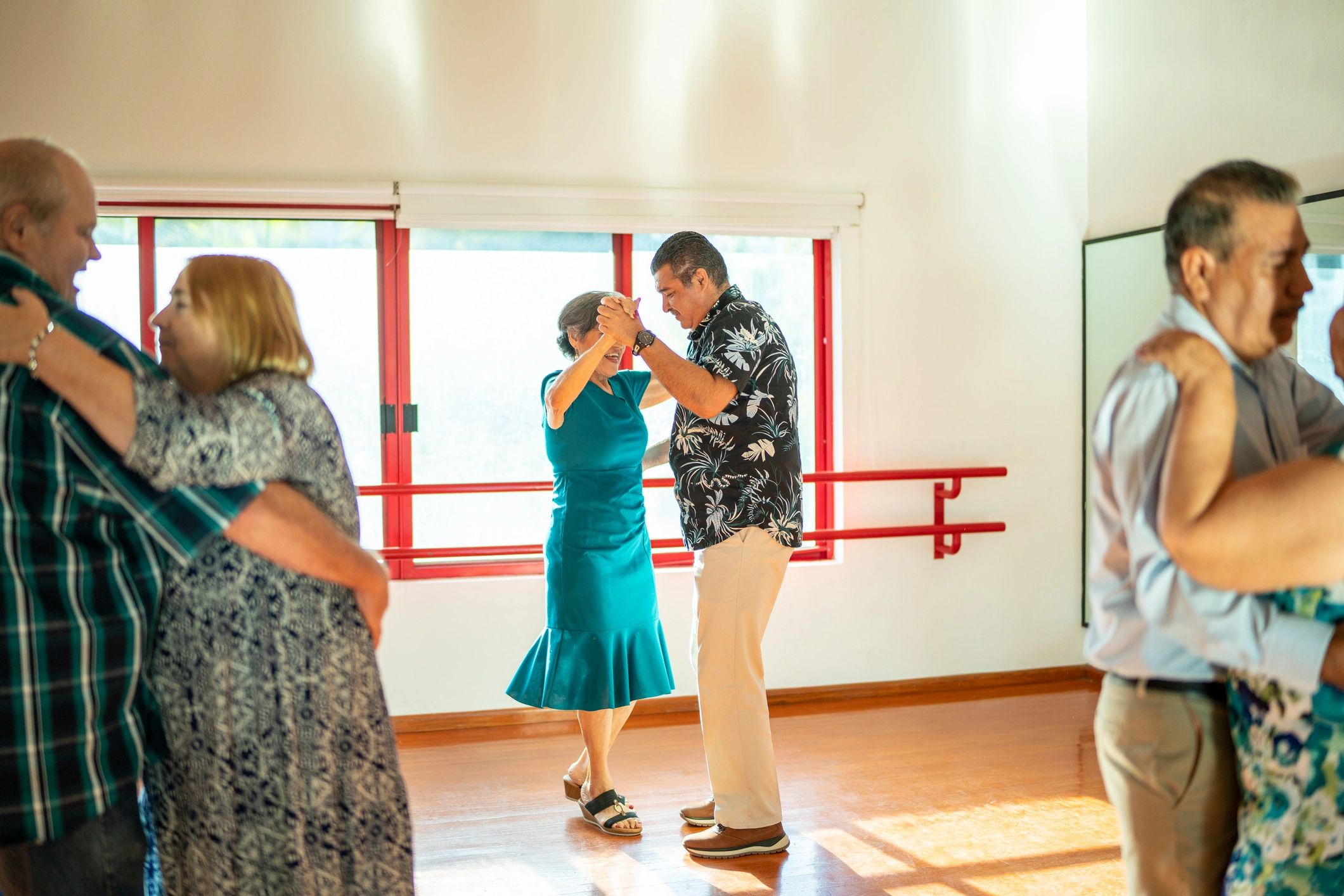 Dance class with couples practicing in a studio